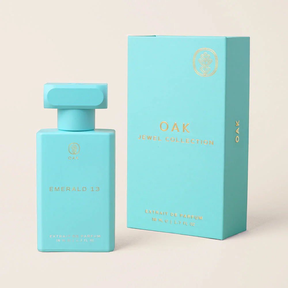 a bottle of perfume next to a box