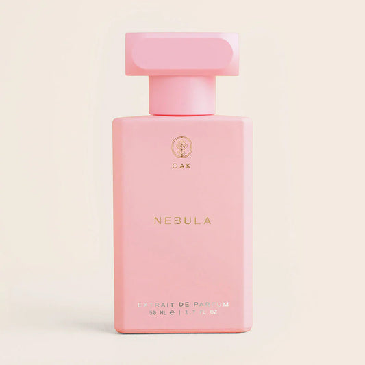 a bottle of pink perfume on a white background