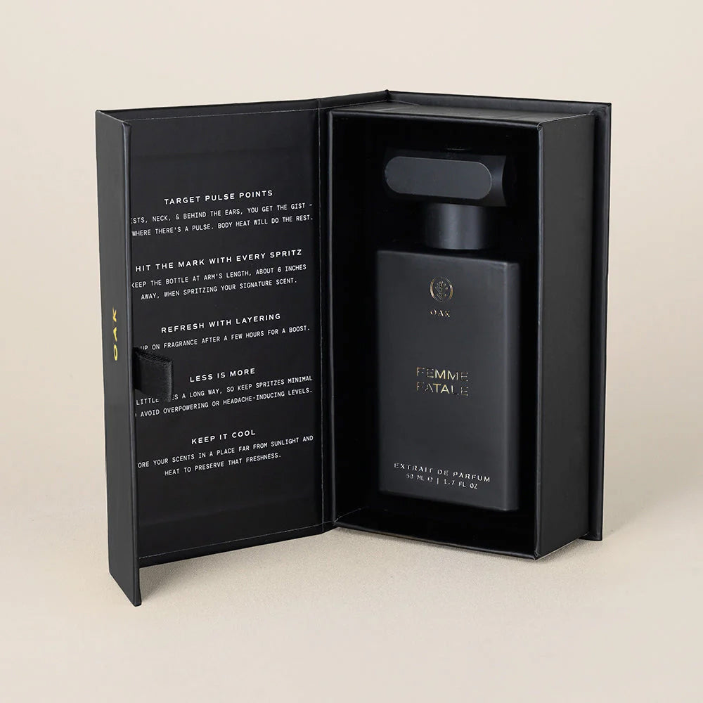 a bottle of perfume in a black box