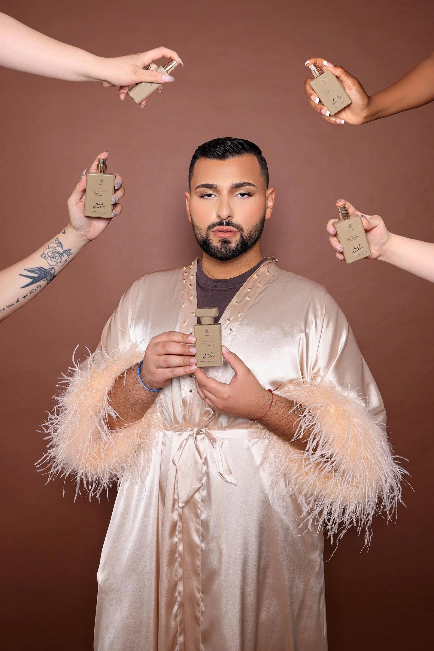 a man standing in front of a group of people holding cell phones