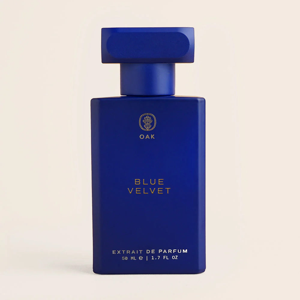 a bottle of blue velvet cologne on a white background