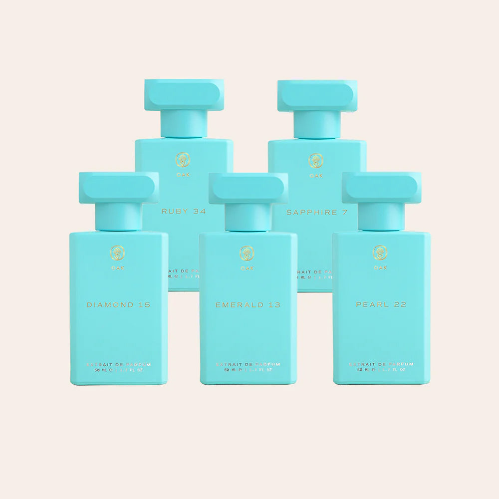 six blue bottles of perfume on a white background