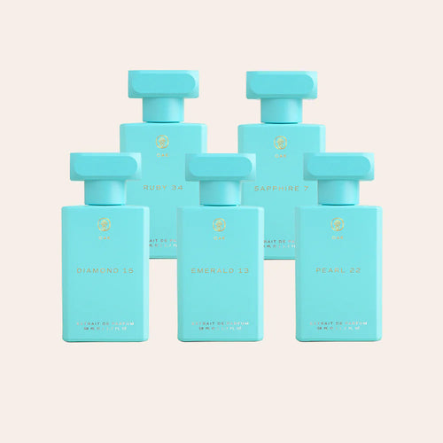 six blue bottles of perfume on a white background