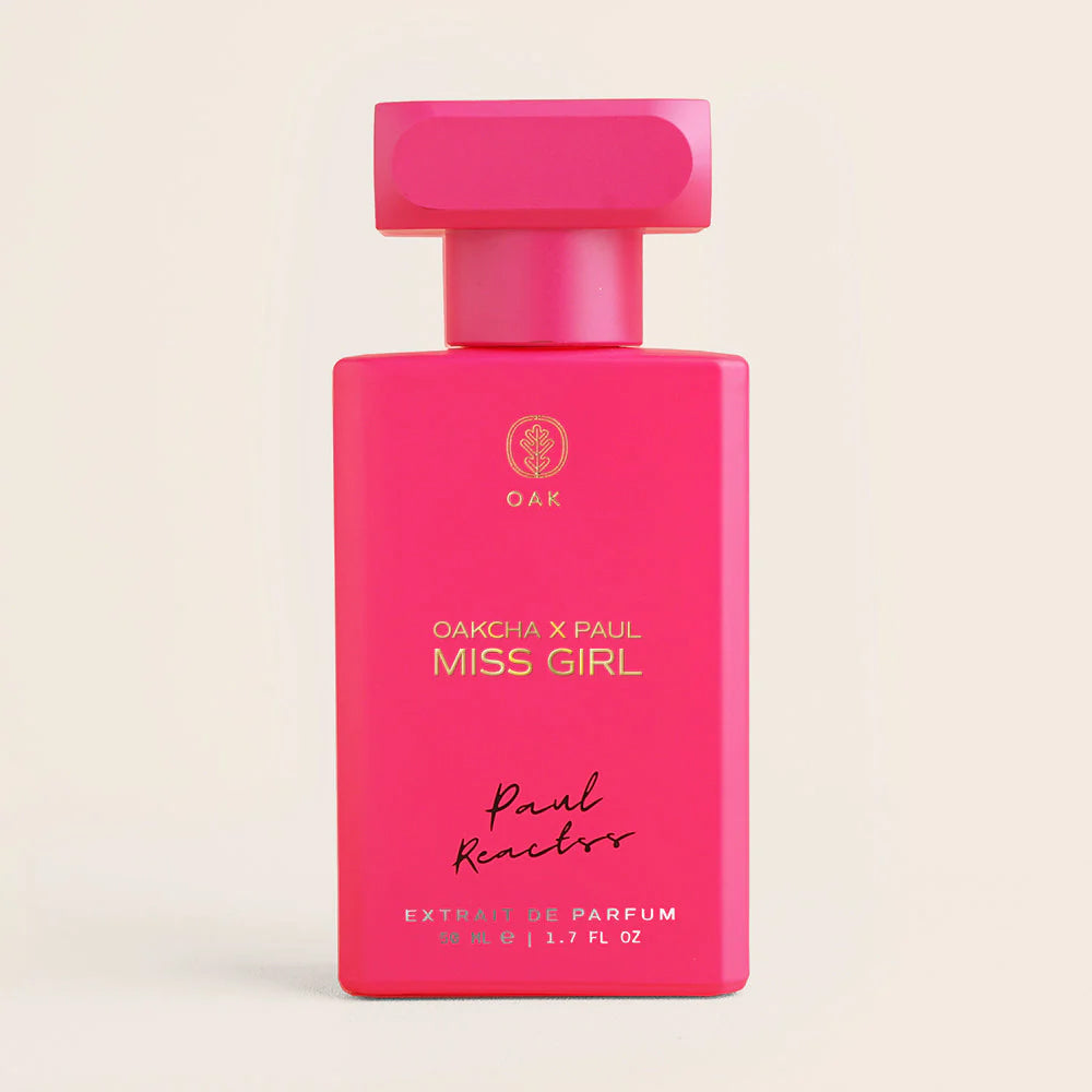 a bottle of pink perfume on a white background