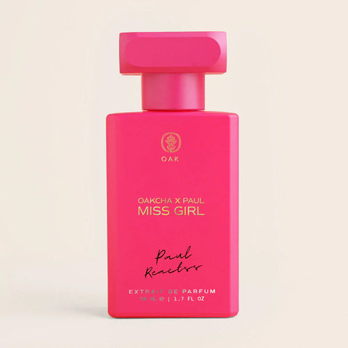 a bottle of pink perfume on a white background