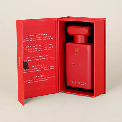 a red bottle in a red box on a white surface