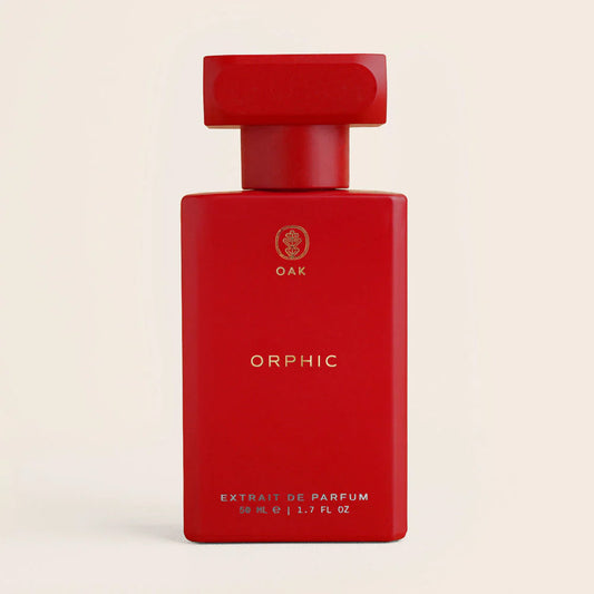 a red bottle of perfume on a white background