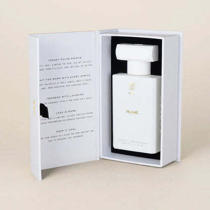 a bottle of perfume in a white box