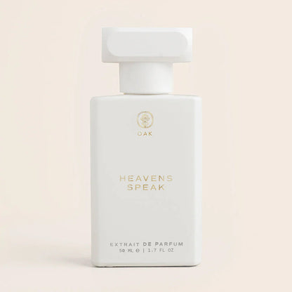 a bottle of heaven's speak perfume on a white background